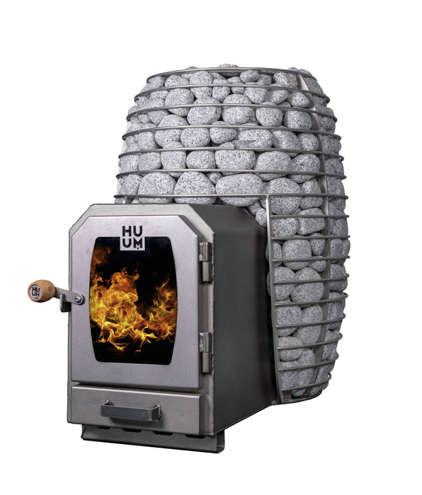 A compact wood-burning stove with a gray metal front door showing a simulated fire, alongside a large cylindrical stone basket filled with gray stones, isolated on a white background.